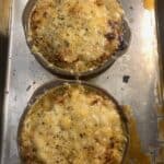 2 dishes of French Onion mac and cheese with melted broiled cheese