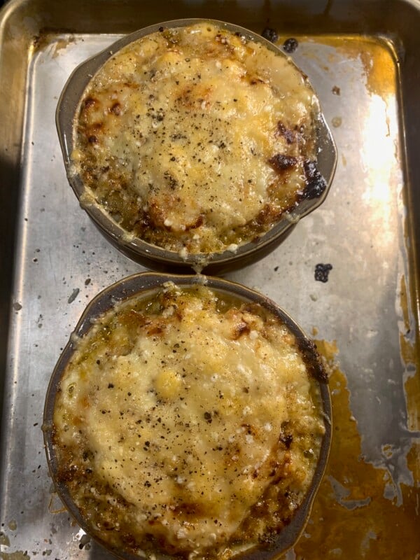2 dishes of French Onion mac and cheese with melted broiled cheese