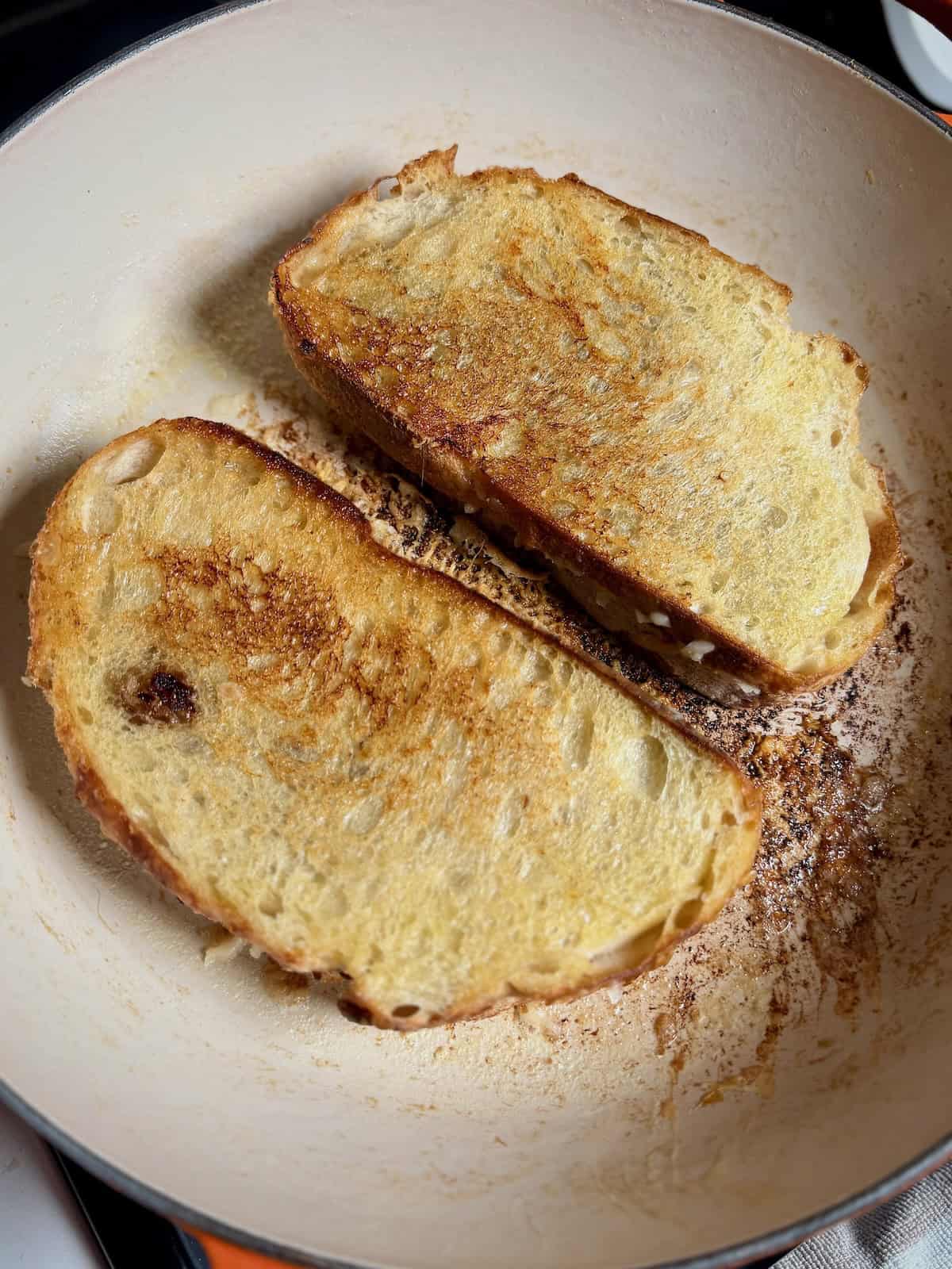 Grilled cheese sandwich toasted until golden brown on both sides.