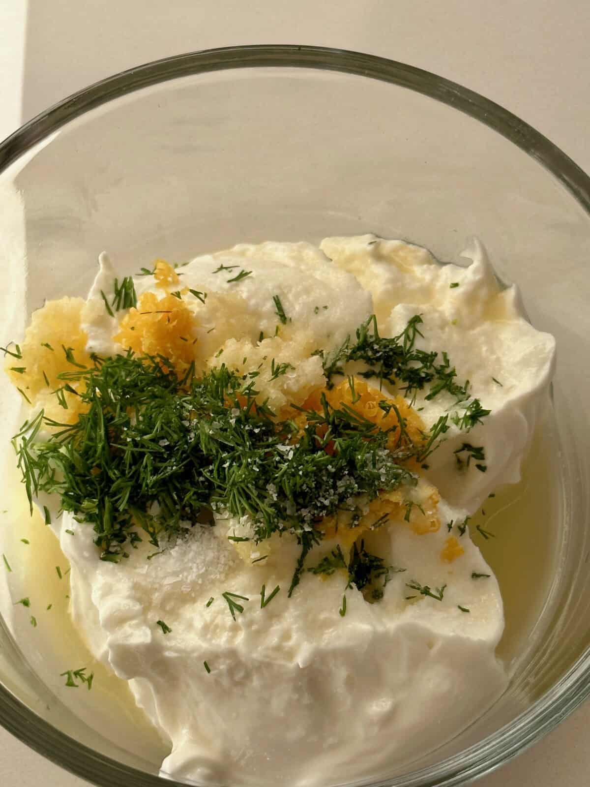 dill and lemon yogurt sauce before mixed together