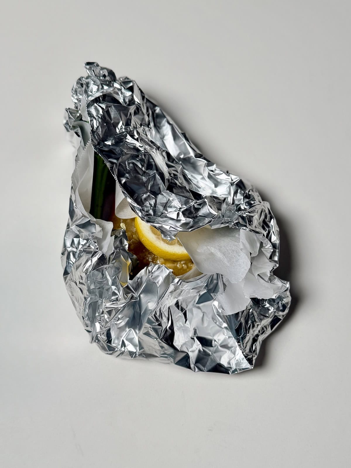 Foil packet salmon sealed and ready to bake in the oven.