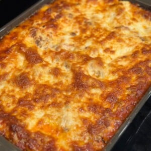 A baking dish with broiled cheesy lasagna