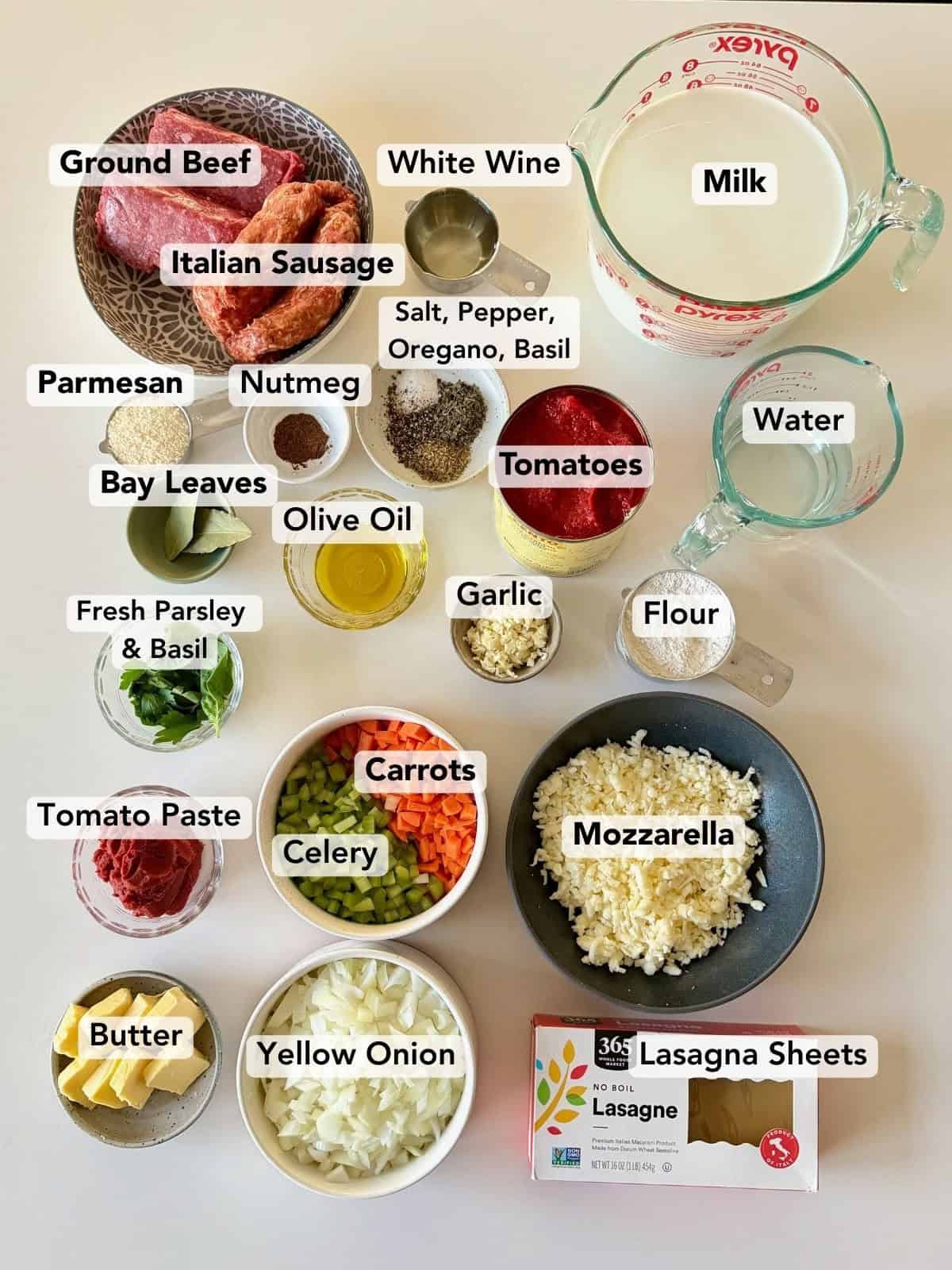 Ingredients for lasagna with béchamel on counter.