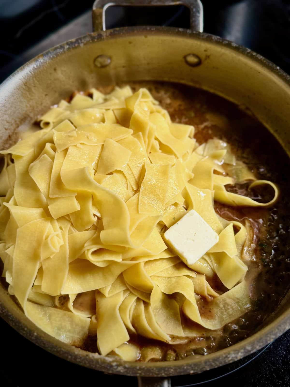 Pappardelle pasta tossed in lemon butter sauce for chicken piccata.