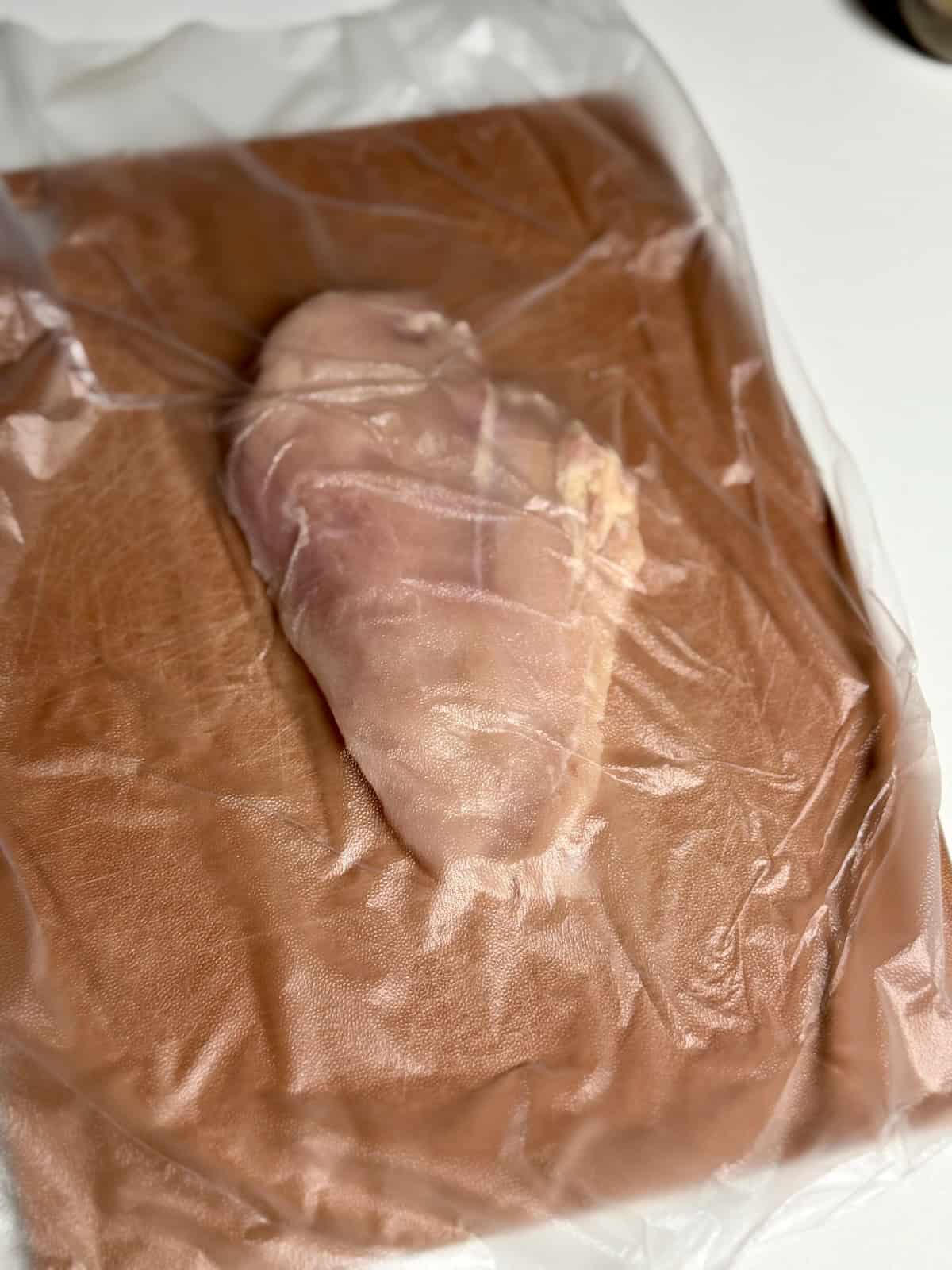 Thin cut chicken breasts ready to be pounded for chicken piccata.