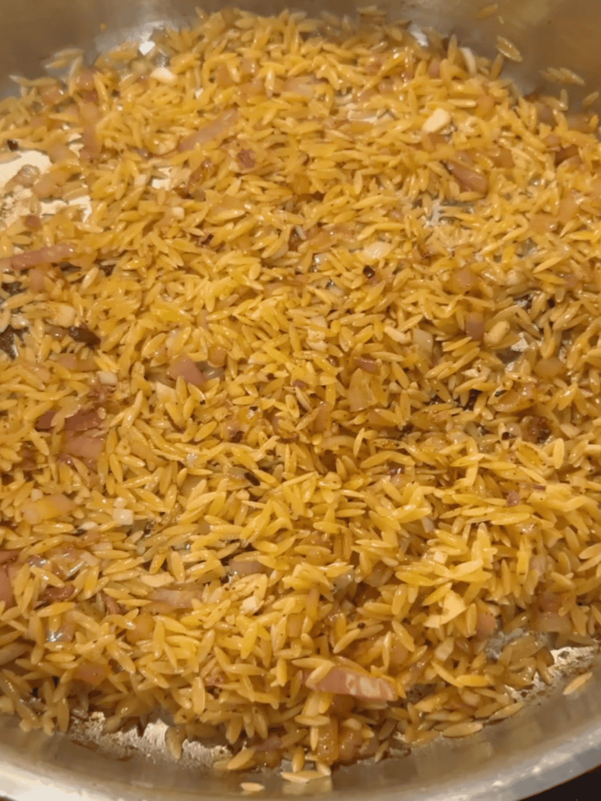 Orzo toasting in pan
