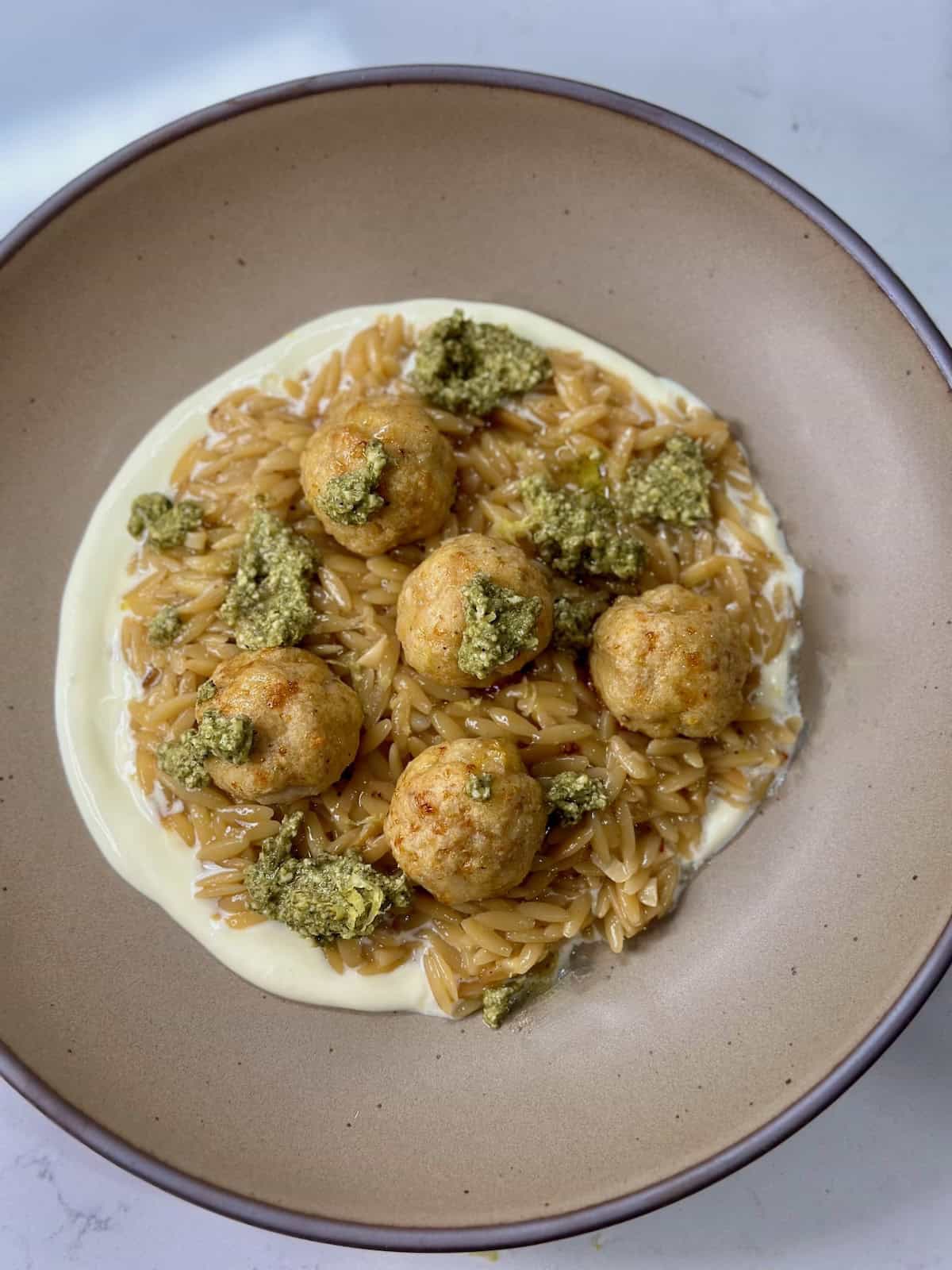 Whipped Ricotta Lemon Orzo with Chicken Meatballs and pesto