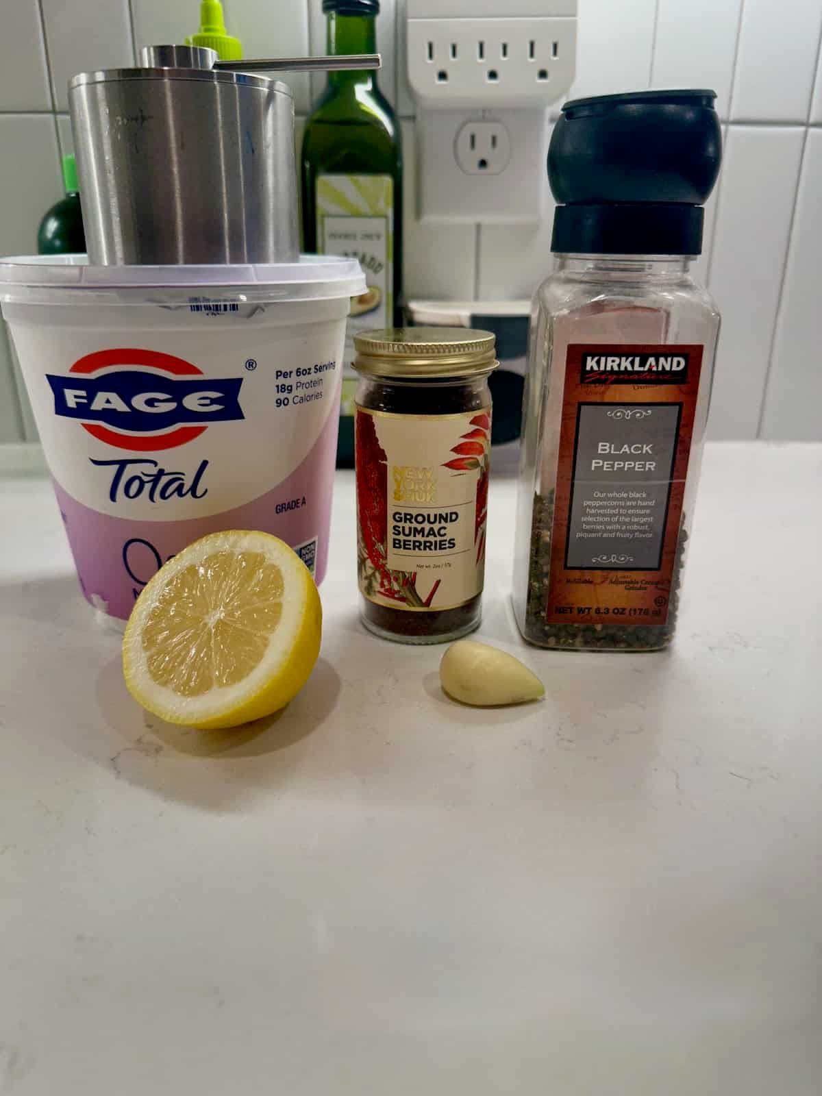 Greek yogurt, lemon, and spices used to make shawarma yogurt sauce.