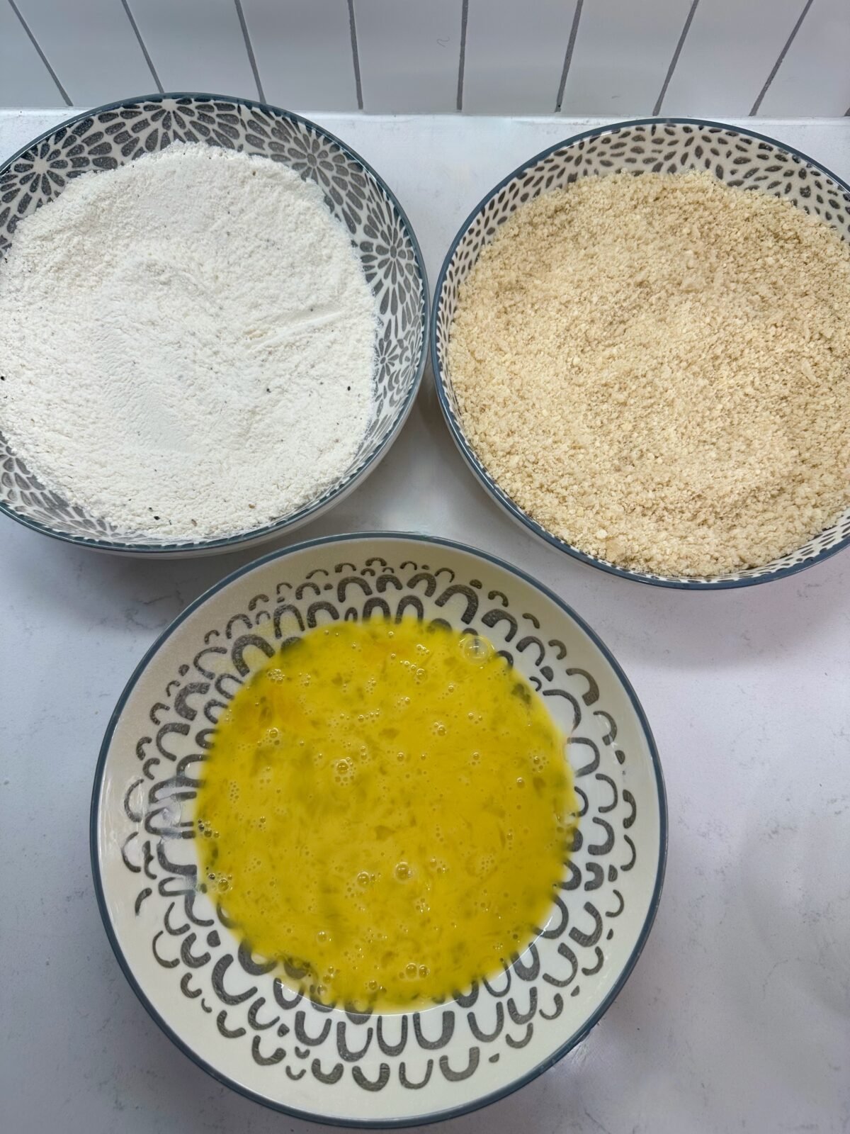 3 shallow bowls - flour, panko breadcrumbs, and beaten eggs
