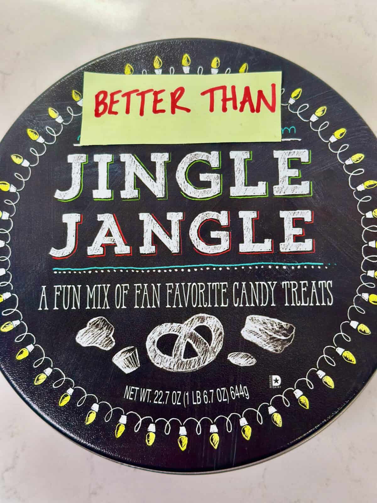 Tin of Trader Joe's Jingle Jangle with a piece of paper that says