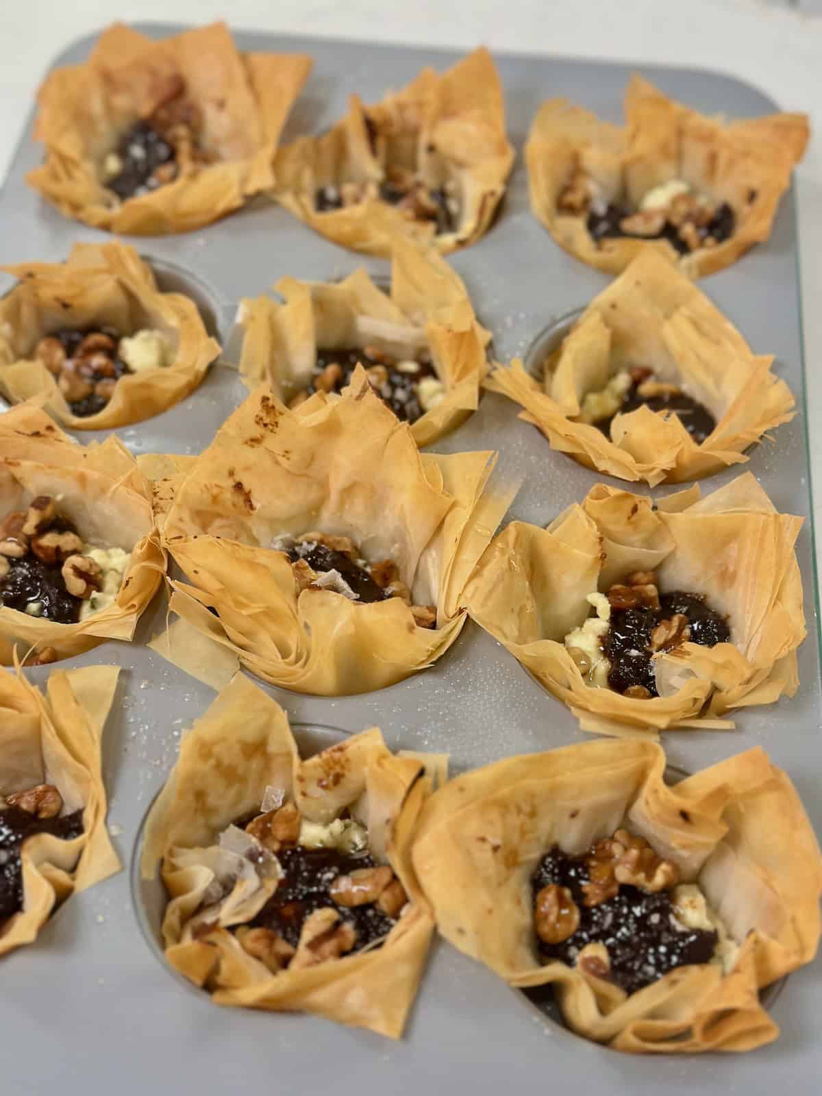 Baked Boursin and fig phyllo cups fresh from oven.