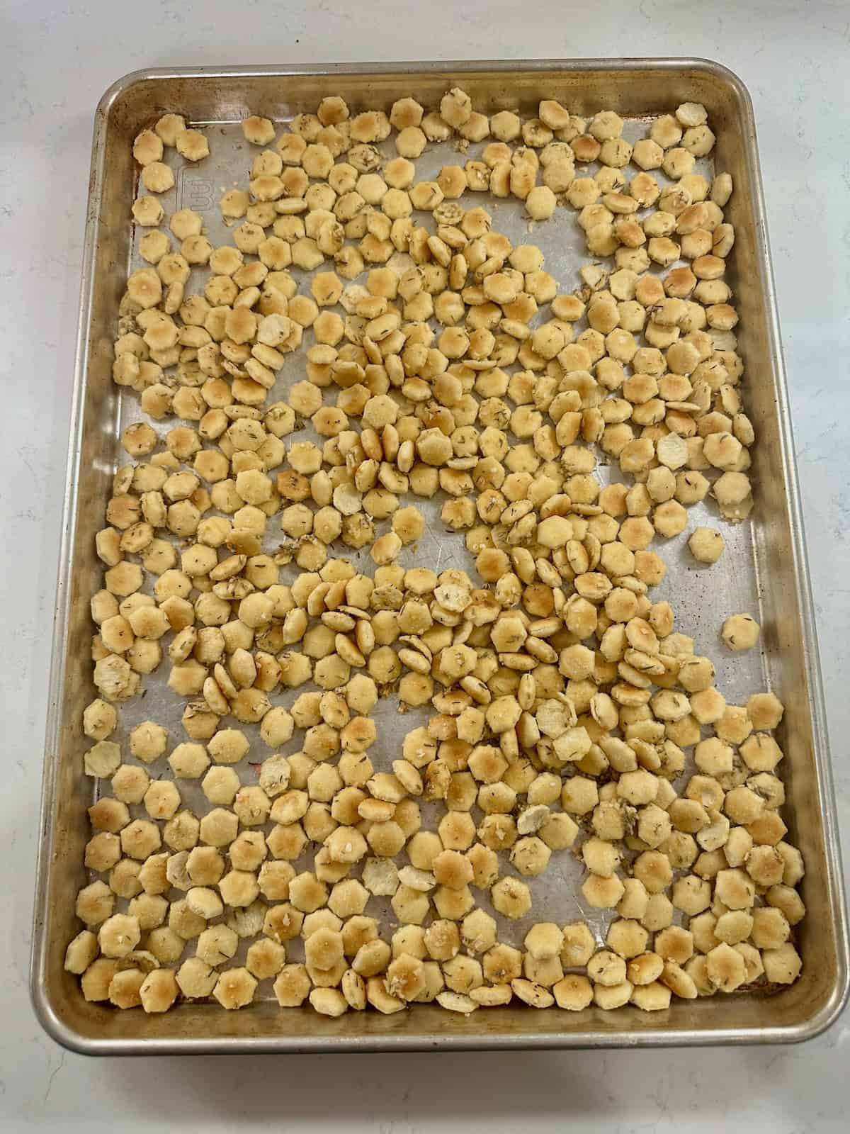 Oyster crackers coated in French onion seasoning before baking.