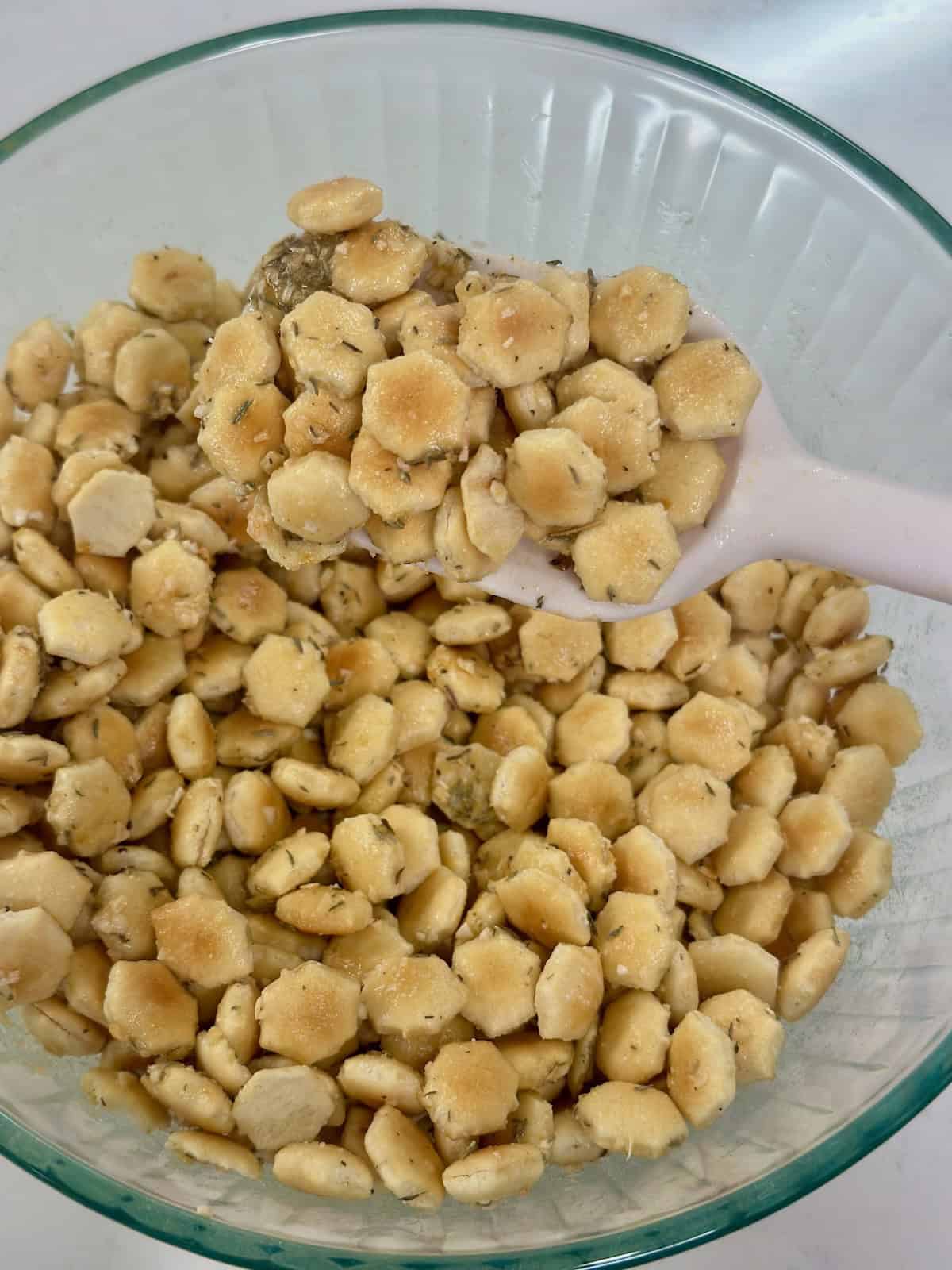 Oyster crackers coated in French onion seasoning before baking.