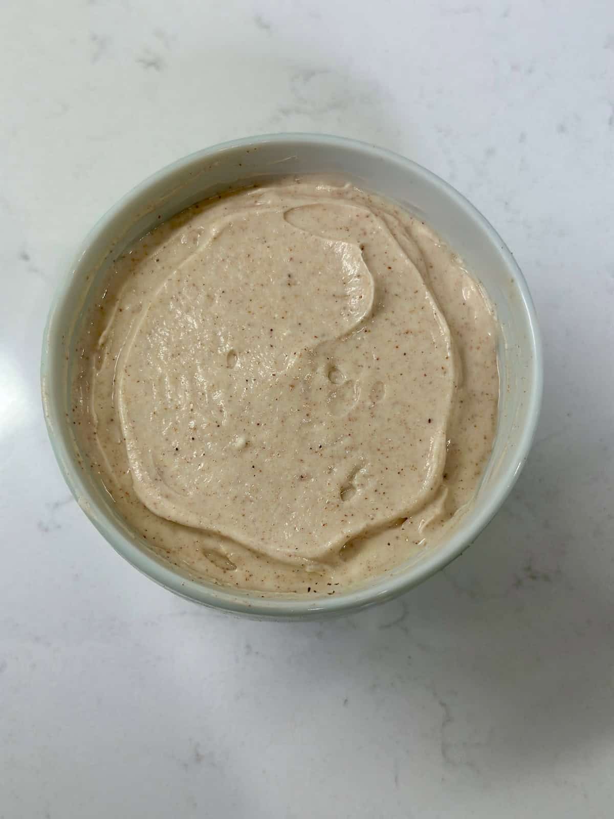 Snickerdoodle cream cheese dip served in a bowl with a smooth top.