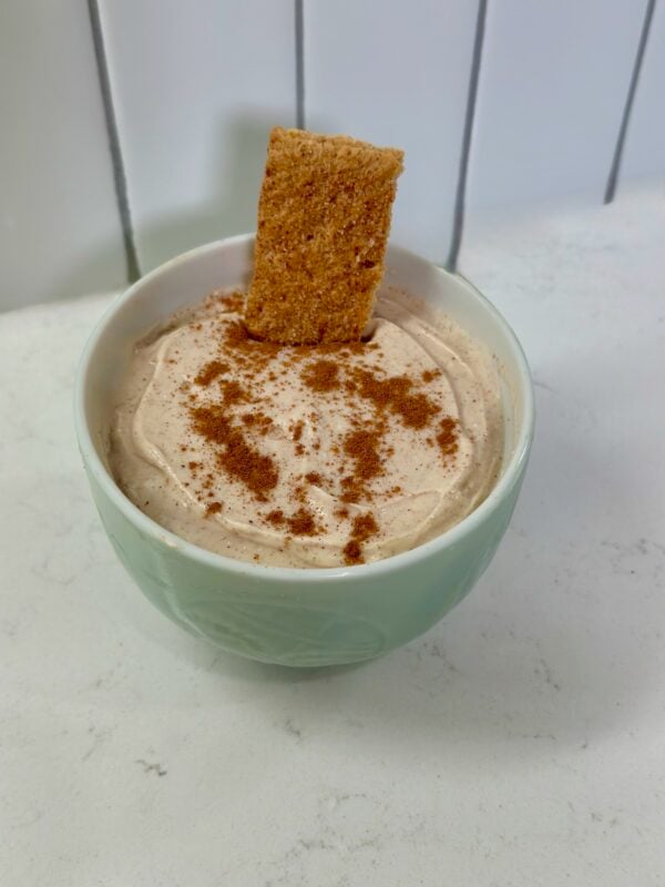 Snickerdoodle cream cheese dip served with graham crackers for dipping.
