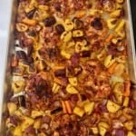 Cooked harissa chicken thighs and vegetables