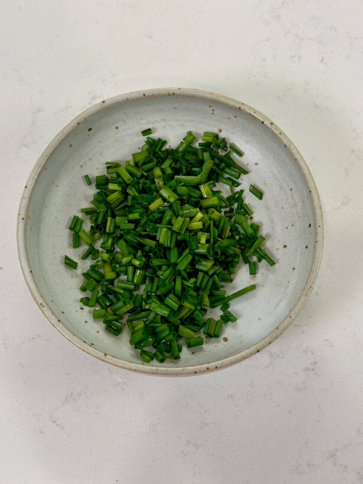 Bowl with chopped chives