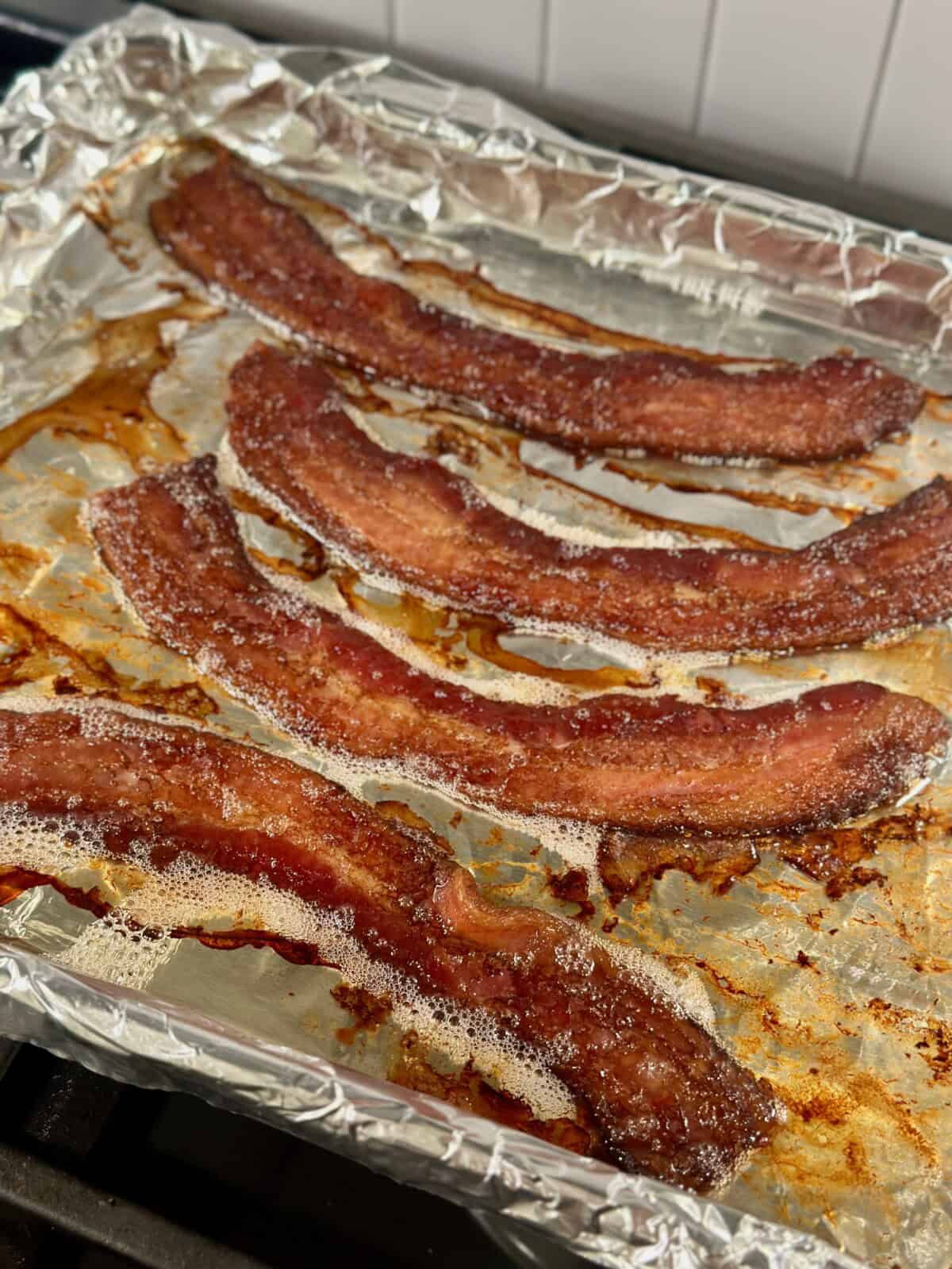 Cooked bacon on baking sheet