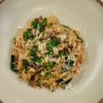 One pan boursin sundried tomato orzo plated in a bowl.