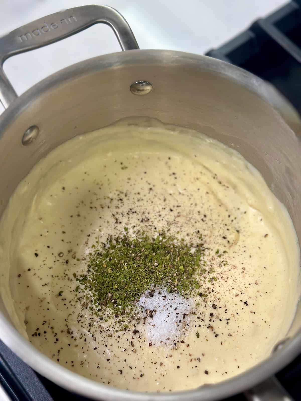 Alfredo sauce with seasonings.