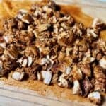 Chipotle copycat chicken chopped into pieces on cutting board.