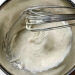 Smooth chipotle sour cream copycat after whisking in metal bowl.