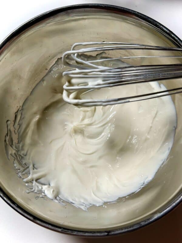 Smooth chipotle sour cream copycat after whisking in metal bowl.