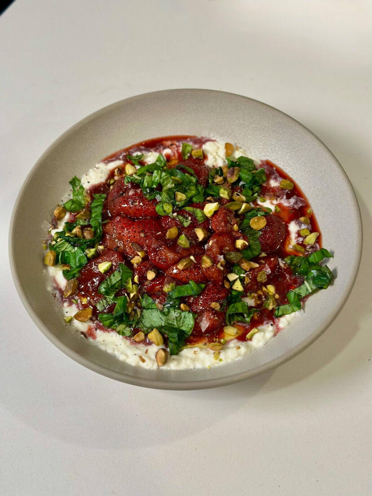 Bowl with Stracciatella, Roasted Strawberries, Basil, and Pistachios