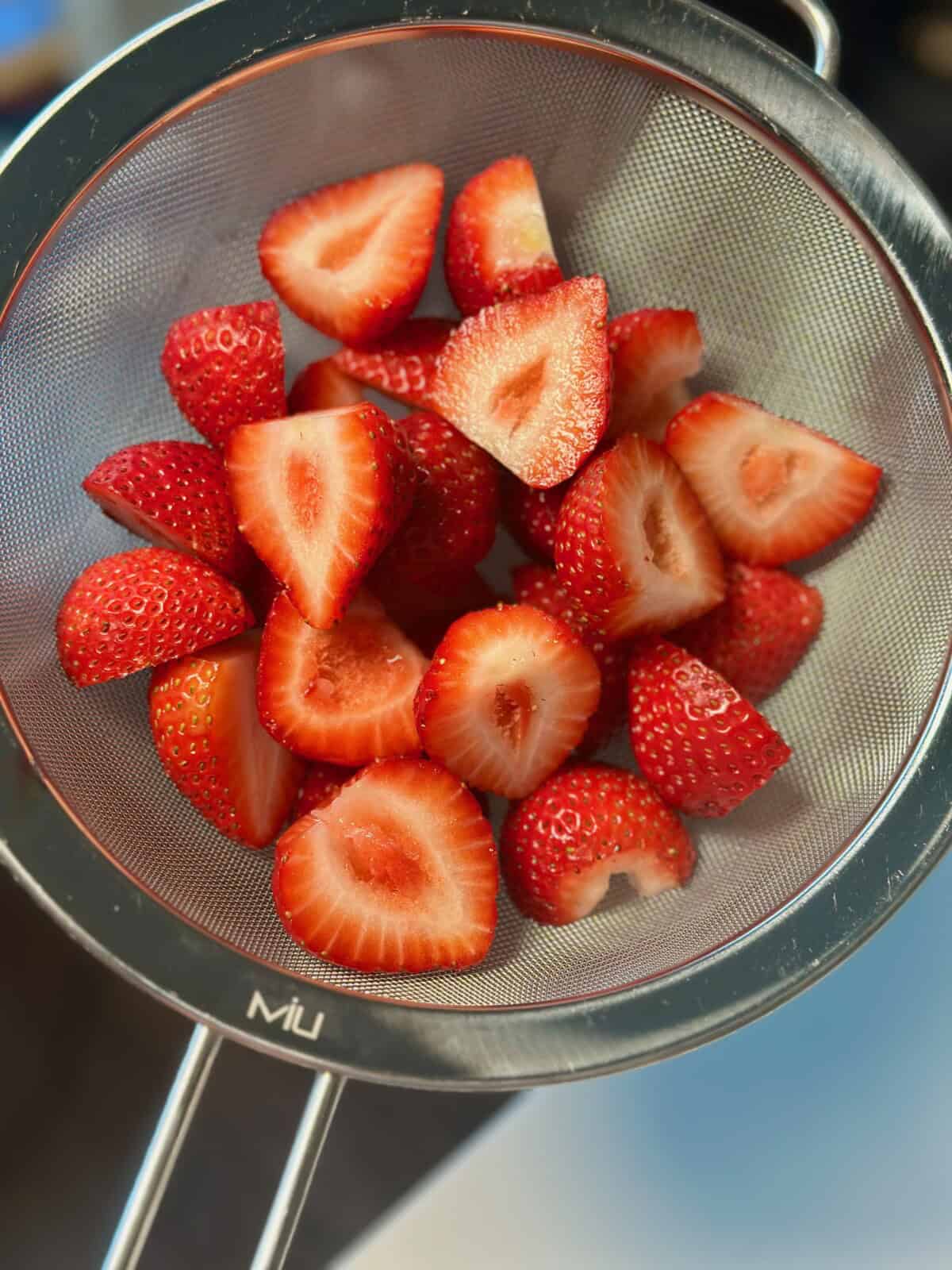 Sliced Strawberries in Sieve