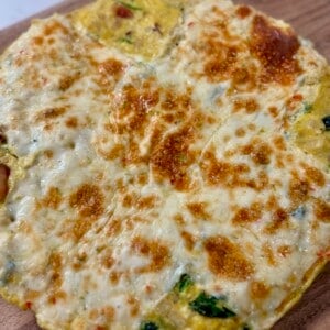 Bacon, Spinach, and Pepper Jack Frittata on Cutting Board
