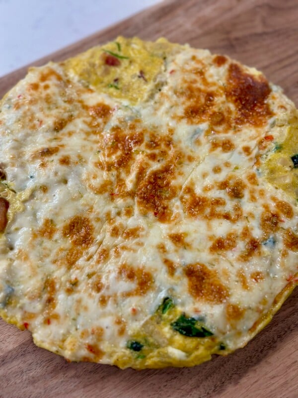 Bacon, Spinach, and Pepper Jack Frittata on Cutting Board