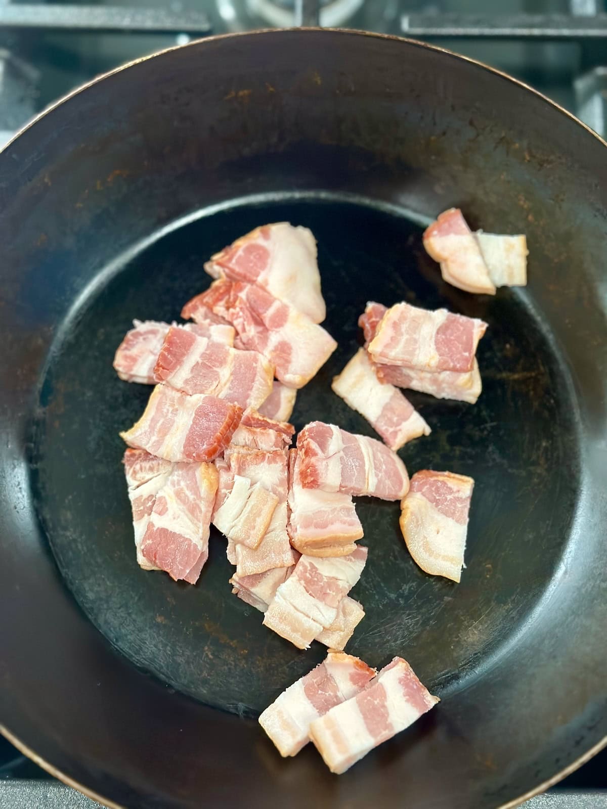 Chopped Raw Bacon in Pan