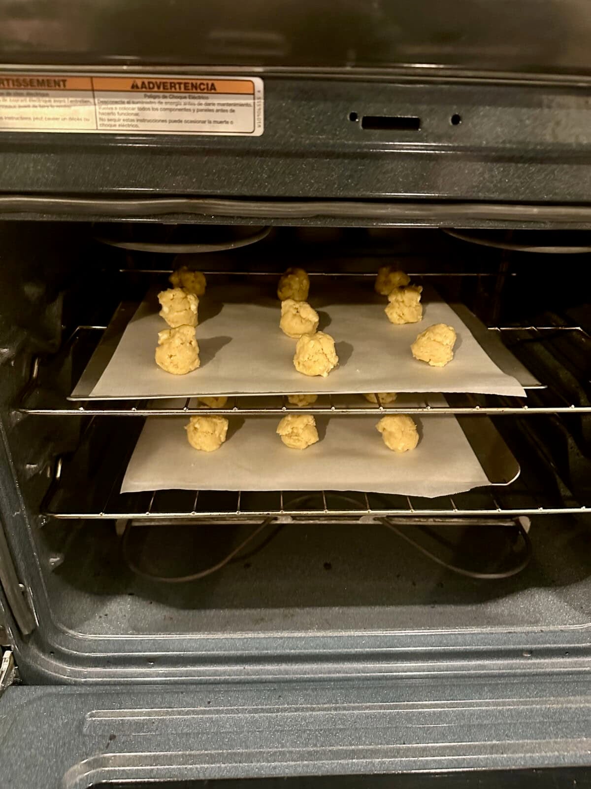 Cookie Dough Balls on Baking Sheets in Oven