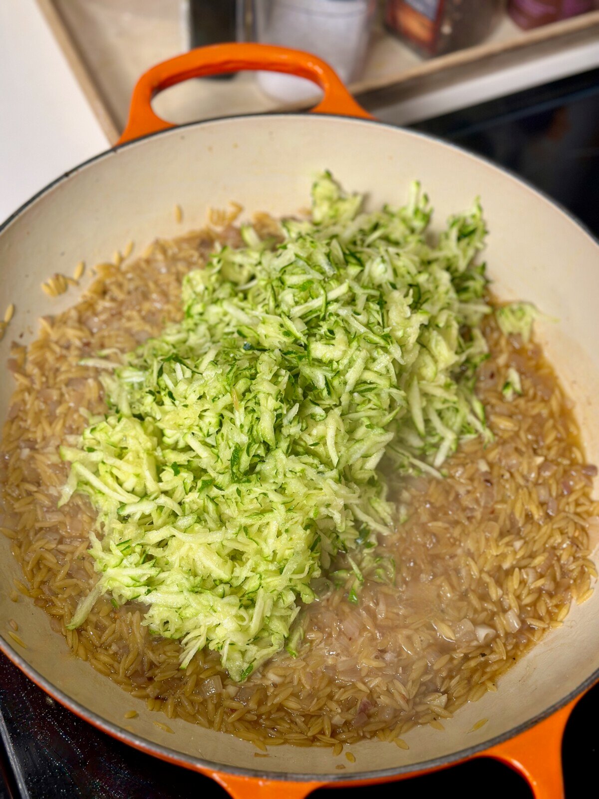 Grated Zucchini On Toasted Orzo in Pan