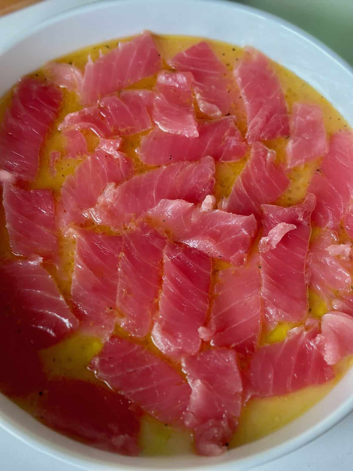 Sliced Raw Tuna in Citrus Vinaigrette on Plate