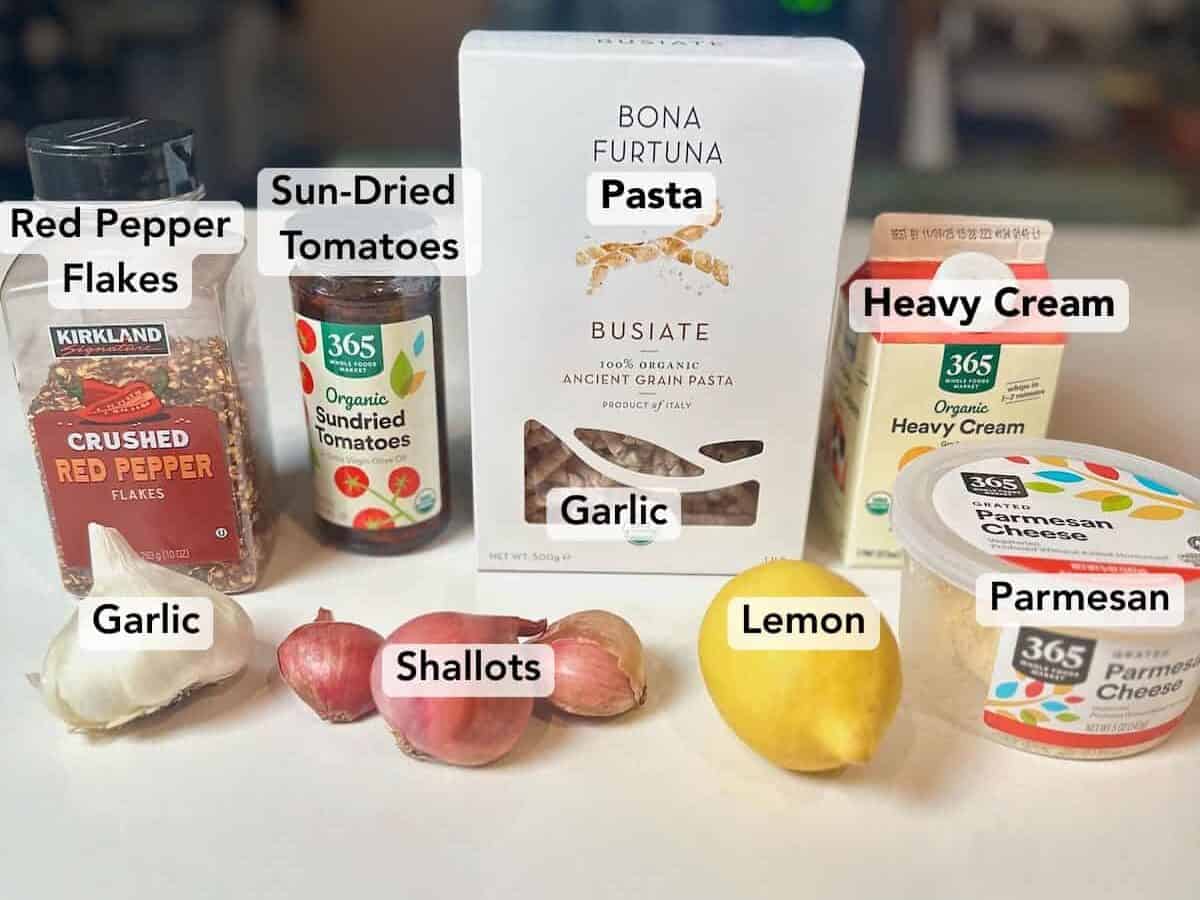 Ingredients for easy creamy sun-dried tomato pasta.