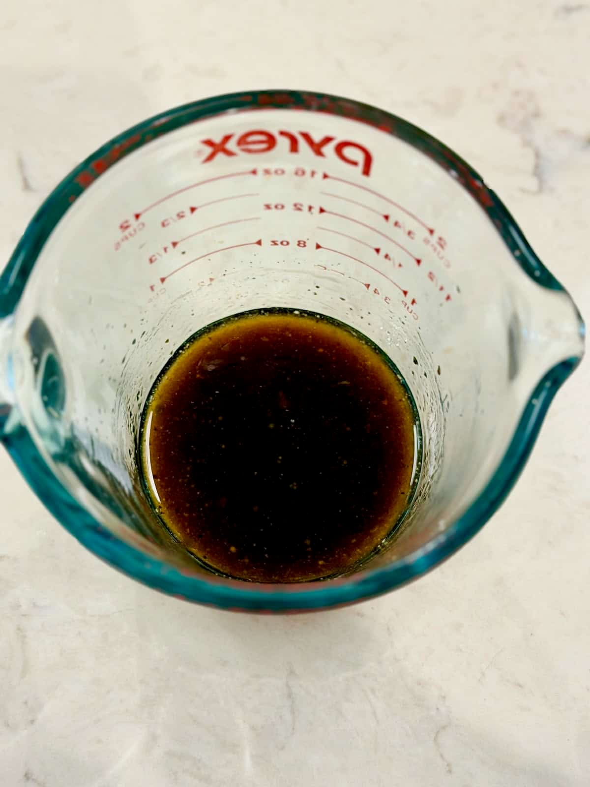 Balsamic lemon dressing with honey and olive oil for stone fruit panzanella salad.