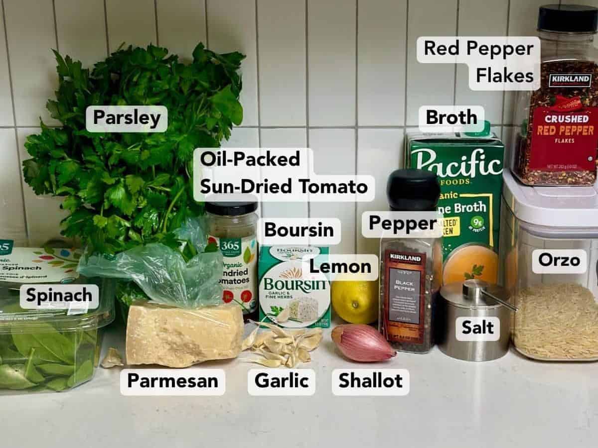 Ingredients for sun-dried tomato boursin orzo with labels.